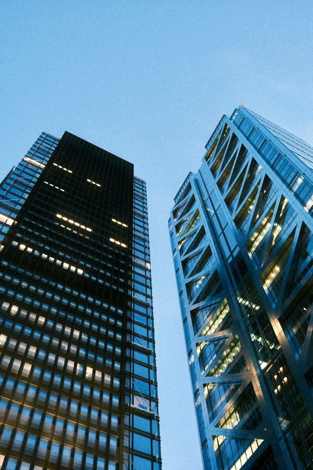 Modern glass office towers, representing the property and institutions Hold.bd helps secure.